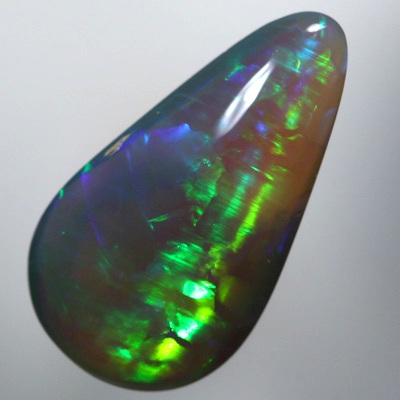 SOLID SEMI BLACK OPAL Chasing rolling flashes through greens and turquoise